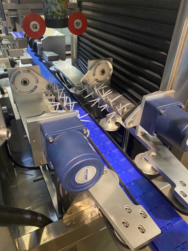 Automated sleeving machine